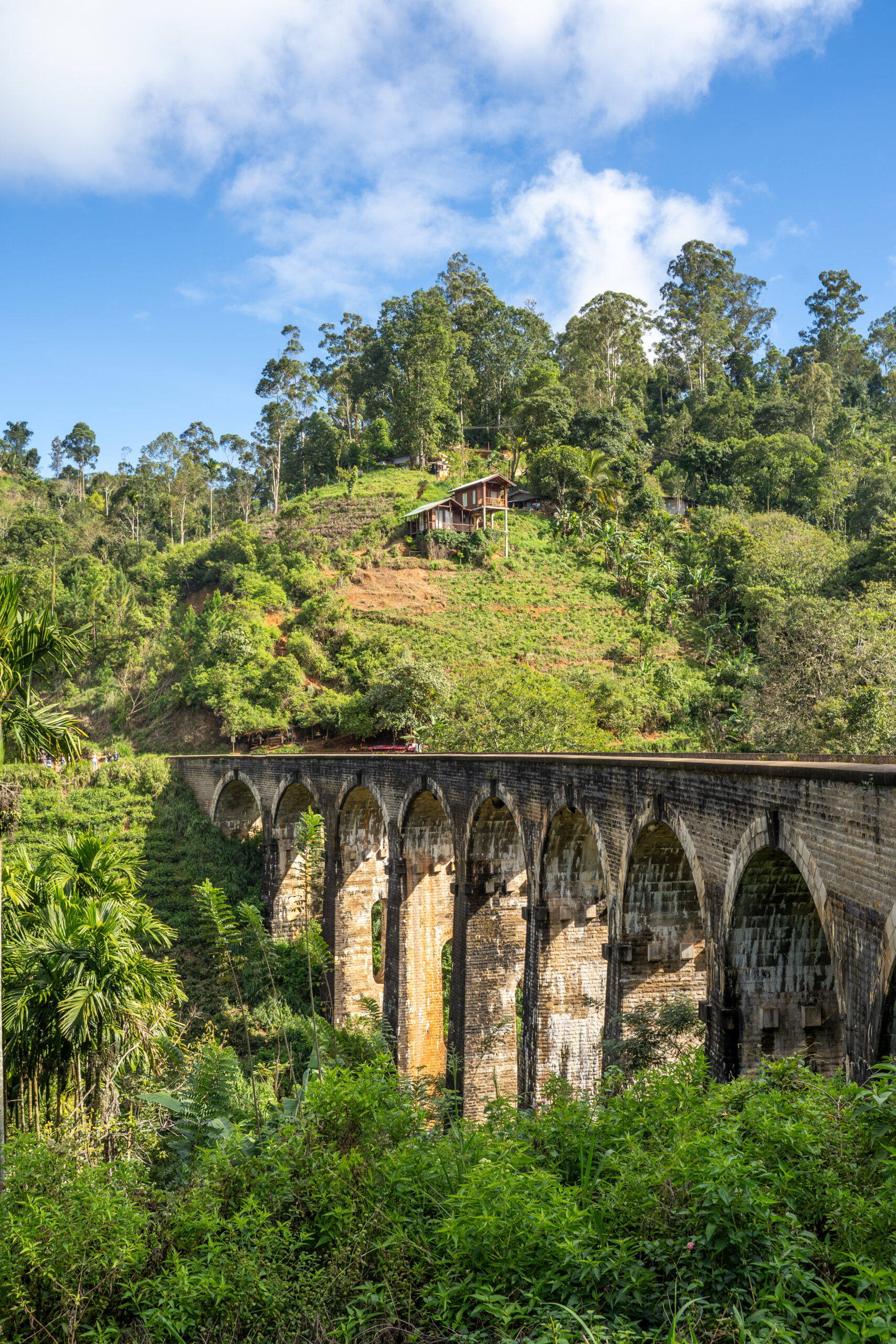 Famous Nine Arch Bridge on a sunny day in Ella, train journey Sri Lanka